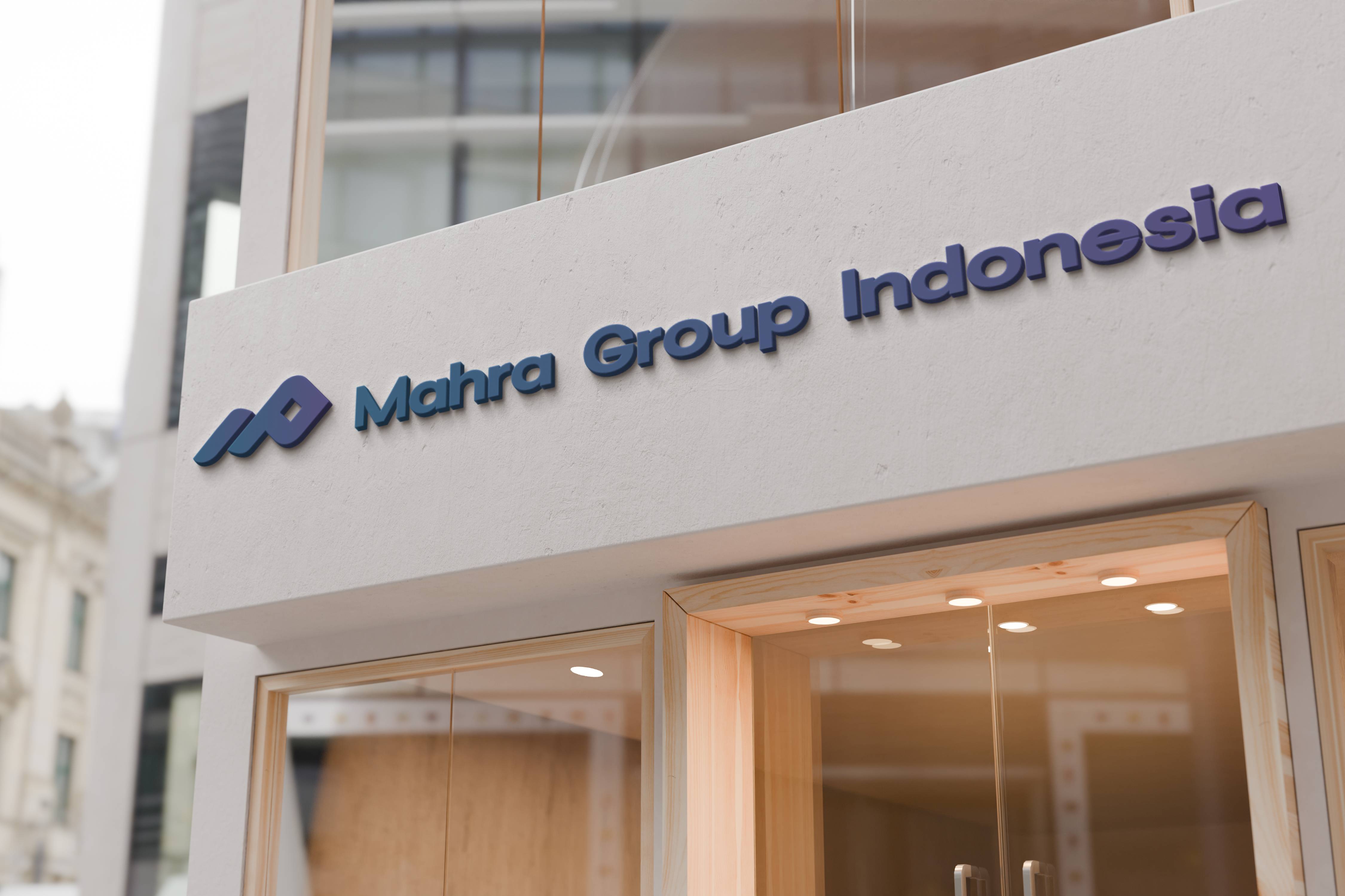 Modern corporate office building with glass facade and TriConsult signage representing the holding company headquarters